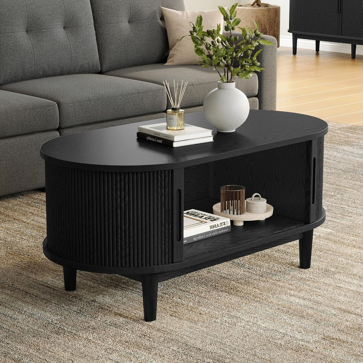 Oval Black Coffee Table with Fluted Tambour Door