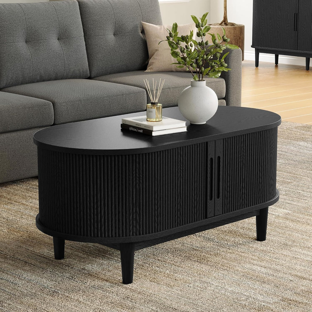 Oval Black Coffee Table with Fluted Tambour Door