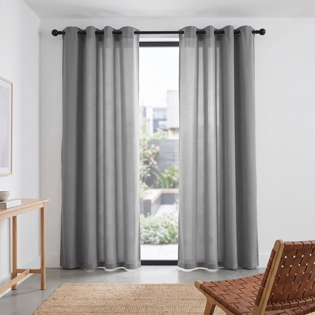Modern Blackout Curtains Grommet Top shown styled in a living room