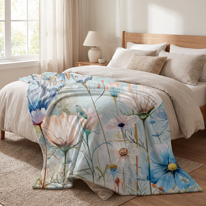 Blue Floral and Butterfly Sherpa Fleece Blanket on a bed